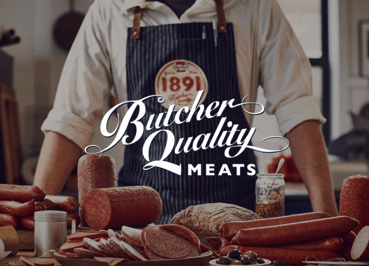Butcher Quality Meats 1891 chef looking at cured meats