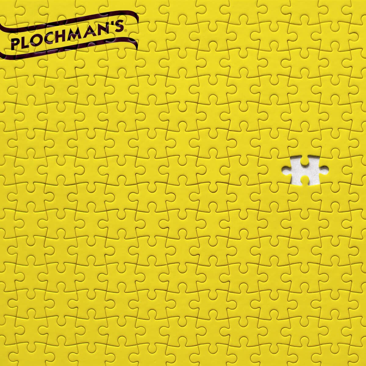 Yellow puzzle with a piece missing