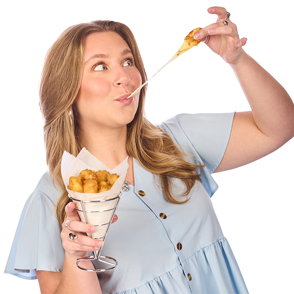 Sydney holding a cone of cheese curds and pulling the cheese