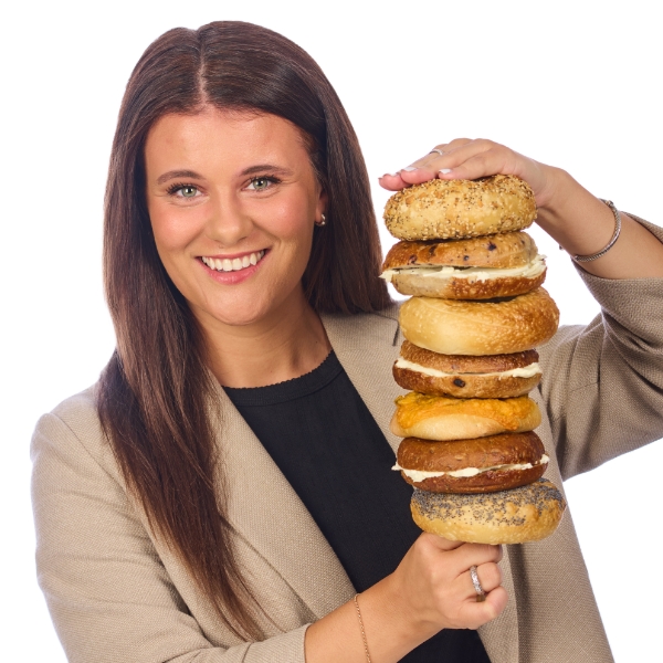 Cassie Boehm with a stack of bagels