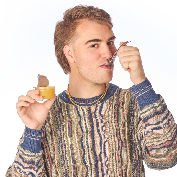 Justin eating applesauce