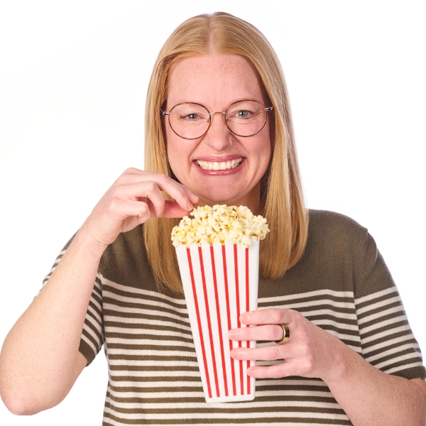 Lauren holding a carton of popcorn