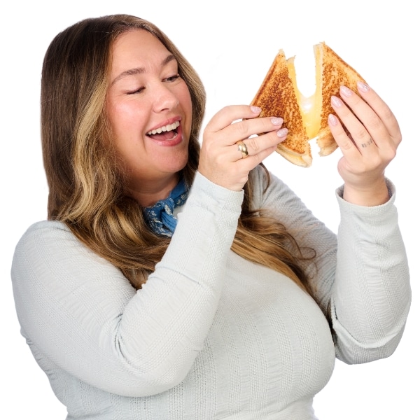Amie holding a grilled cheese sandwich