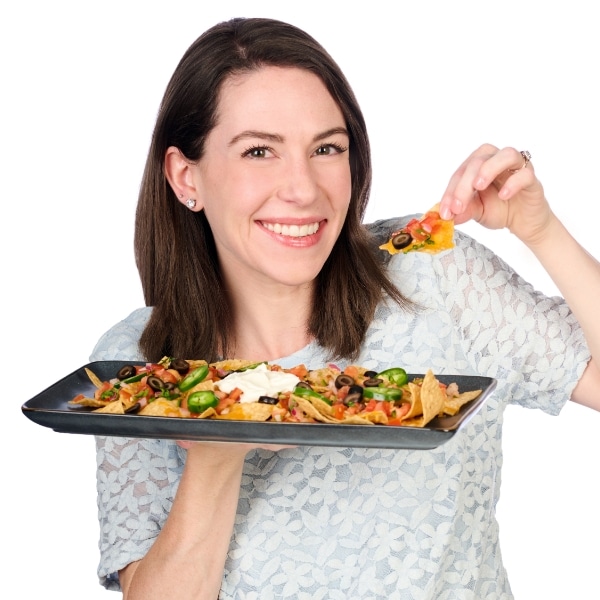 Christine holding a tray of nachos