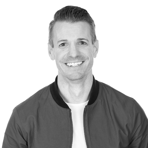 Justin's headshot in black and white