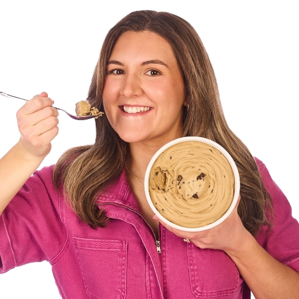 Morgan taking a spoonful of cookie dough