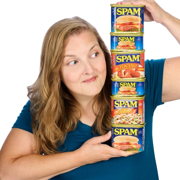 Amy holding a tower of SPAM cans